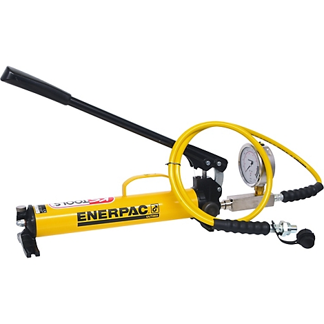 Gelbe Hydraulikpumpe mit schwarzem Hebel, Manometer und gelbem Schlauch.